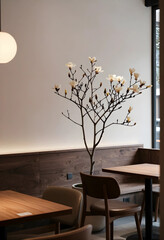 Obraz premium Interior design and minimalist lifestyle, blooming magnolia tree in a modern cafe with wooden furniture and soft ambient lighting for calm atmosphere