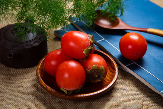 Ripe Fresh Red Persimmons On Wooden Serving Tray