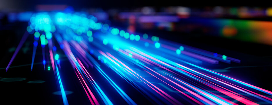 Abstract digital background featuring glowing blue and pink light streaks of data transmission