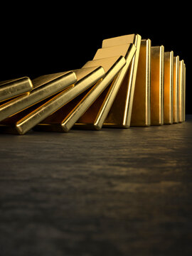 Conceptual gold bullion bars falling like dominos representing a sudden financial market collapse