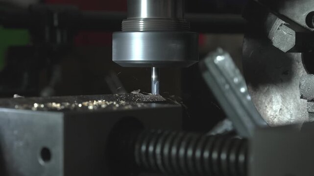 A CNC metal milling machine bores holes, cuts threads, and makes cuts in copper, brass, aluminum, and steel workpieces.