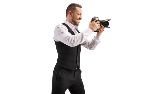 Photographer in a vest holding a professional camera