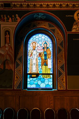 Stained glass window with saints in Orthodox church interior © VolodymyrNadtochii