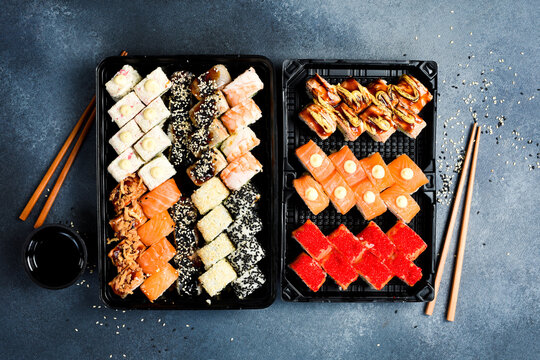Japanese food. Set of sushi rolls with caviar, fish and shrimp. Food delivery. Free space for text.