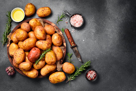 Organic food. Basket with raw potatoes. Top view, close-up.