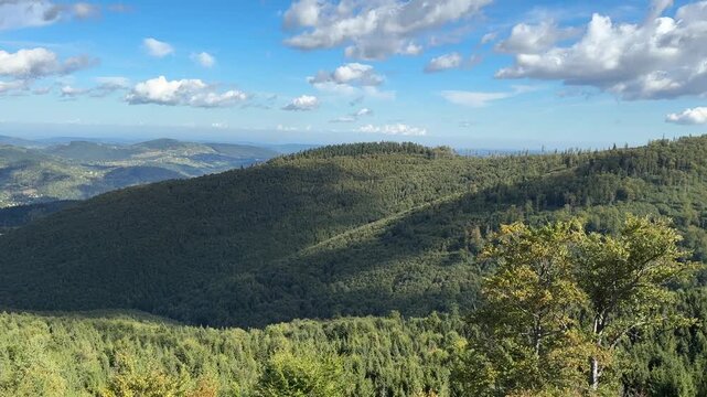 Panoramic view of Babia Gora massif from lookout tower with tourist binoculars in Poland
