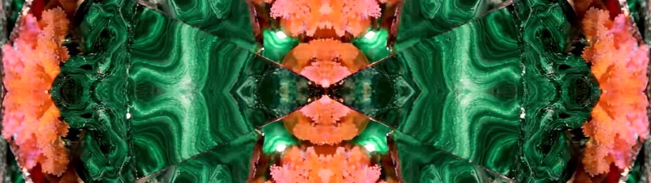 Kaleidoscope creating intricate geometric symmetry from green malachite and textured pink coral forms Organic shapes merging.
