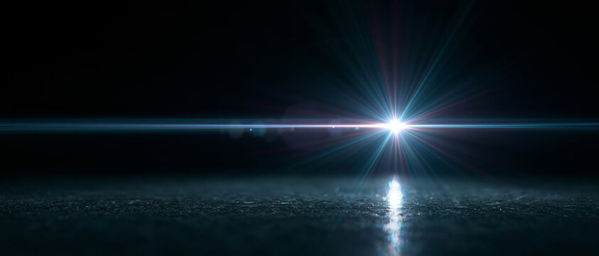 Bright horizontal lens flare on dark background