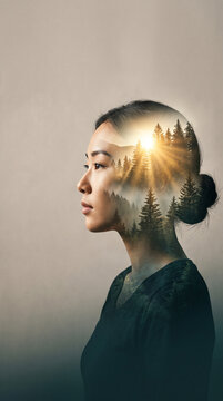 Woman&rsquo;s profile silhouette blended with a glowing sunrise above distant mountains, double exposure portrait symbolizing mental clarity, hope, mindfulness, emotional wellbeing, inner peace, mental heal