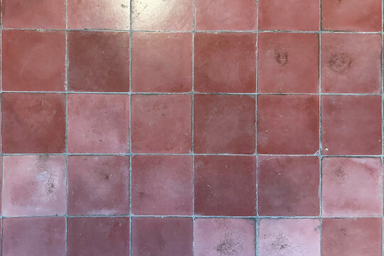 Pink ceramic tile texture with rectangular grid pattern, subtle surface variations, and a weathered matte finish. Soft dusty tones create a vintage decorative surface for walls, floors, and interiors.