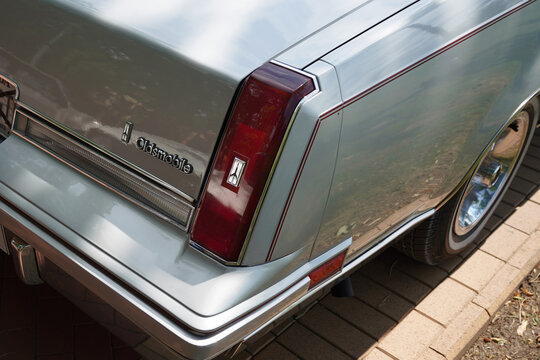 Close up detail of rear taillight and emblem on silver 1981-1986 Oldsmobile Cutlass Supreme Brougham 4th gen classic car, Palic, Serbia, Jul 5, 2026
