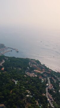 Aerial view flying over Monte Carlo and Monaco. Vertical video