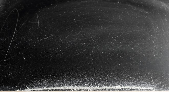 Abstract dark textured surface with subtle scratches and dusty grainy film grain aesthetic for minimalist artistic background