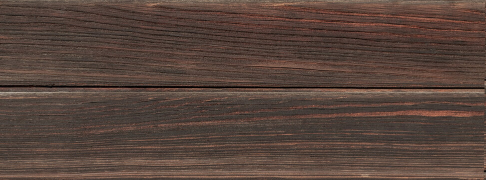 Dark wooden plank background with rustic horizontal grain for texture and design