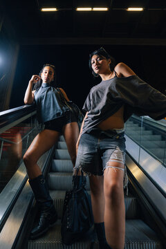 Friends Posing on Escalator at Night