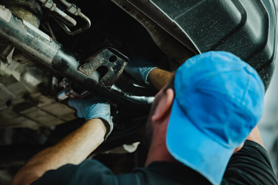 Mechanic Working Under Car