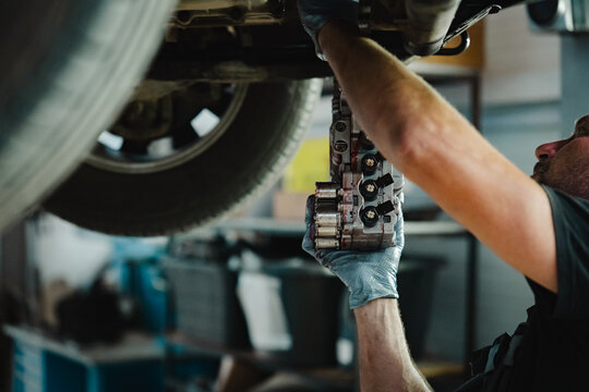 Mechanic Installing Transmission Component
