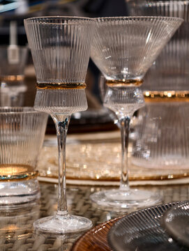 High end wine glasses reflecting light on an upscale dining table