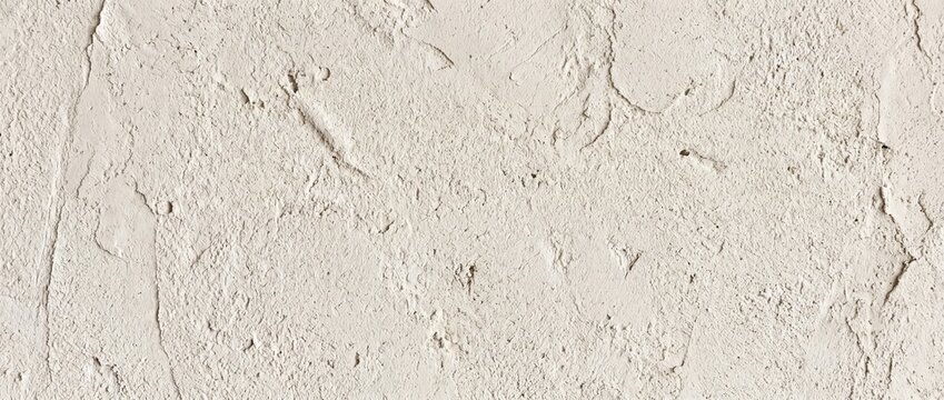 Rough plaster scratch coat texture background. Off white coarse stucco wall surface with trowel marks. Construction and renovation backdrop with copy space