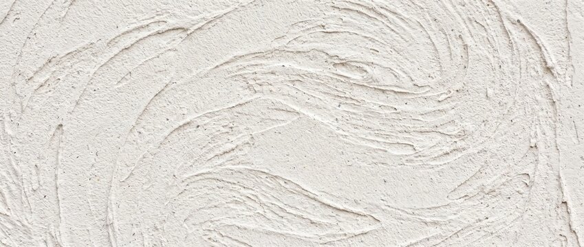 Troweled plaster sweep texture background. Off white textured stucco wall with circular swirling strokes. Clean architectural interior finish