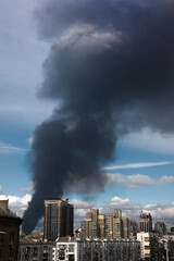 Obraz premium Fire and Thick Smoke in a Residential Area After a Russian Drone Strike in Ukraine