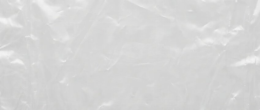 Crumpled clear plastic wrap texture. Wrinkled cellophane packaging film background. Polythene overlay texture