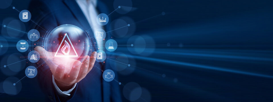 Energy specialist holding the hand glowing molecule icon. Professional analyzing fuel processing data and economic growth graph chart on hologram screen. Petroleum technology system.