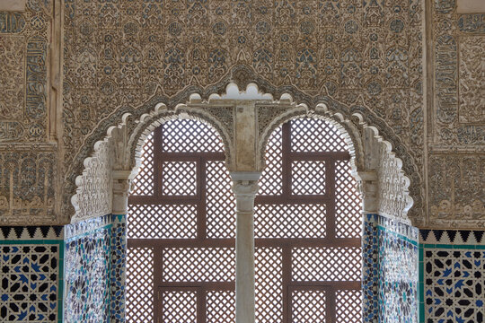 Double arched window with lattice and ornate Moorish plasterwork