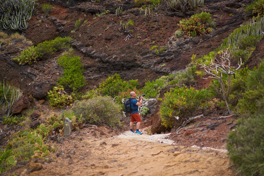 Hiker photographing on Tenerife trail