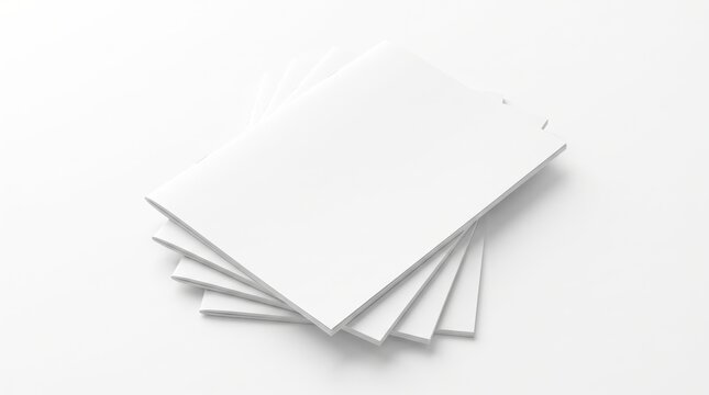 Fanned stack of blank white paper brochure booklet catalog mockups on white surface