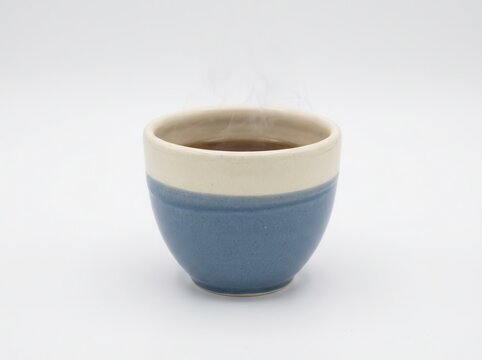 Ceramic tea cup with subtle steam, quiet afternoon concept