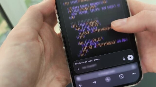 Reviewing mobile software application code layout text script on responsive cellular touchscreen. Female fingers sliding across dark automated programming interface document on portable