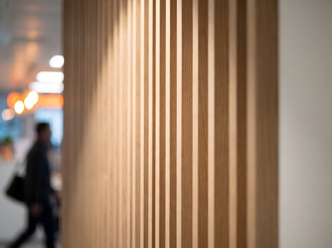 Modern wooden slat partition in urban lobby