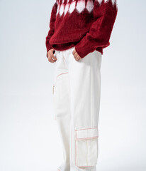 Winter fashion men's outfit: Fleece knit cardigan paired with white wide-leg work pants © jeson