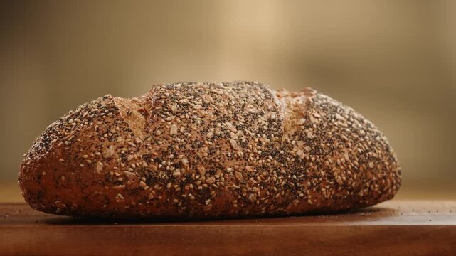 Bread assortment close up, rustic sourdough loaf, whole grain seed bread and baguette on Mediterranean table, knife cutting artisan bread, Italian bakery