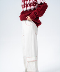 Winter fashion men's outfit: Fleece knit cardigan paired with white wide-leg work pants © jeson