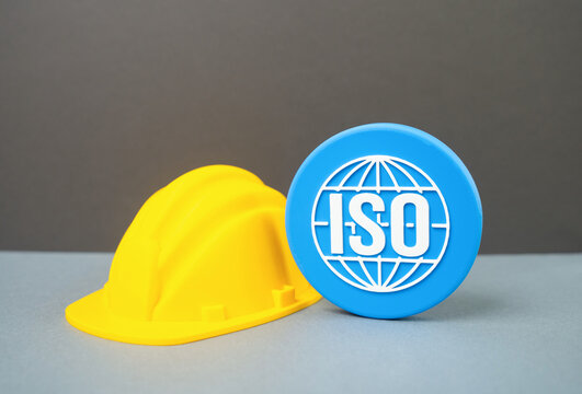 Construction helmet and ISO symbol. Standards in the construction industry. Quality control, certification, workplace safety and international building requirements.