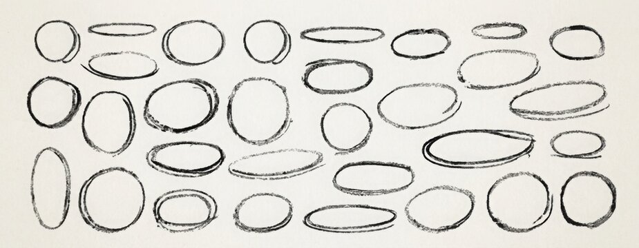 Set of hand drawn black chalk circles and oval frames with rough textured outlines, irregular round shapes and sketchy borders isolated on a clean white background.