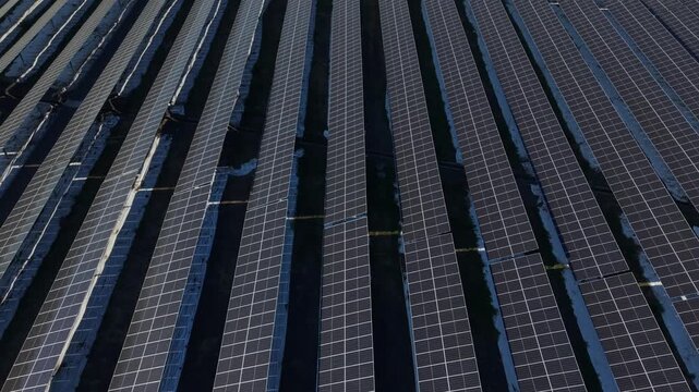 Aerial view of the PLTS Bali Timur solar farm featuring rows of photovoltaic panels capturing sunlight in Kubu, Bali, Indonesia.