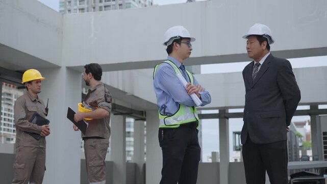 Construction worker in safety vest and hard hat joins business manager professional discussion with diverse worker team at urban building construction site project planning meeting