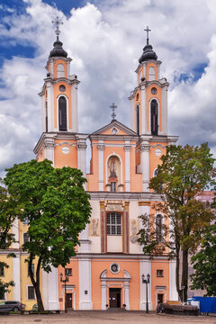 Facade of the Church of St. Francis Xavier in Kaunas, Lithuania. Baroque architecture under a partly cloudy sky