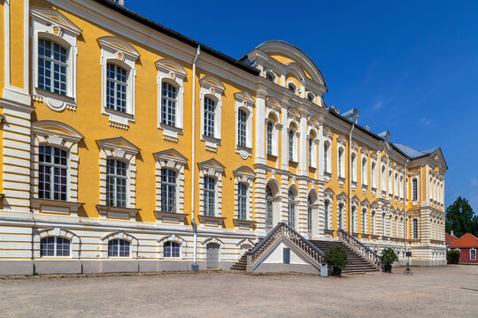 Main facade of the Rundale Palace in Latvia. Baroque and rococo palace architecture under a clear blue sky