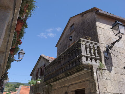 View of the historic stone architecture and traditional balcony in the village of Combarro, Pontevedra, Spain.