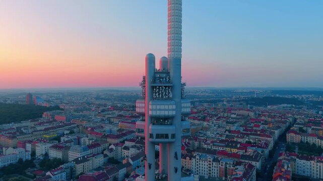 Aerial view of Zizkov Television Tower featuring its unique architectural structure and communication antennas overlooking the urban landscape of Prague, Prague, Czechia.