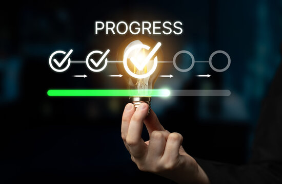 Progress Concept With Light Bulb and Check Marks Representing Innovation, Achievement, and Successful Execution in a Business Environment. Bitwise.