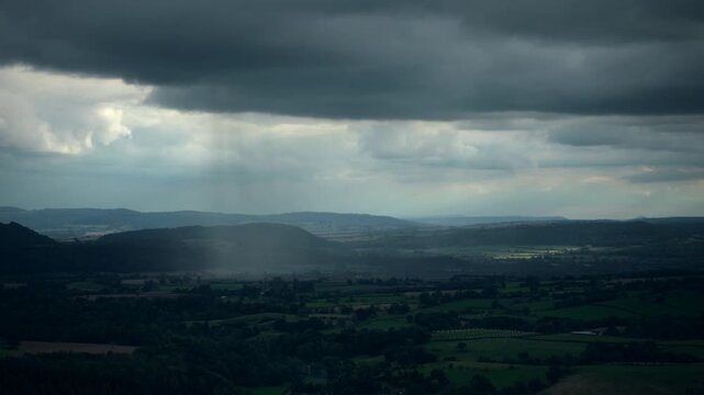 A heavy rain shower passing through the Shropshire countryside in England