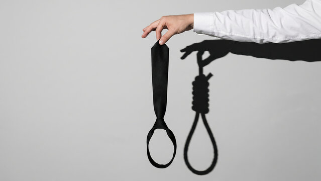 Corporate burnout, office worker necktie casting noose shadow, day job