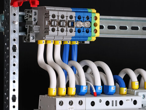 Electrical screw terminals for connecting copper electrical wires with metal lugs in electrical switchboard. 