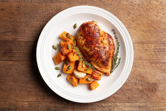 Autumn meal: roasted chicken with pumpkin and herbs