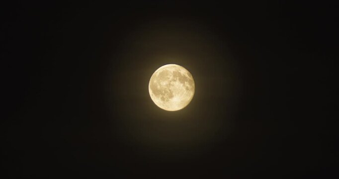 Full Golden Moon Shining in Dark Night Sky Close Up View